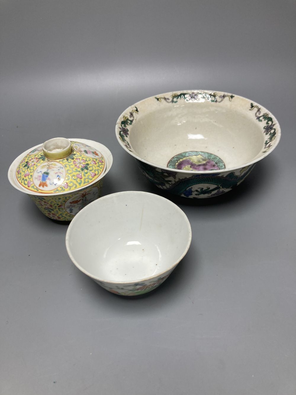 A Chinese yellow ground chupu, a famille rose tea bowl and a famille verte crackle glaze dragon bowl, diameter 18cm